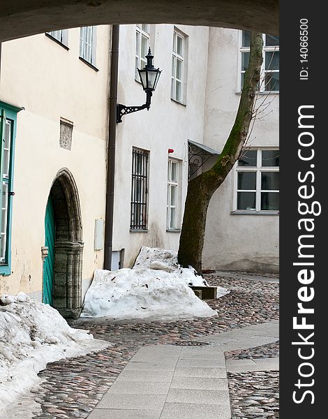 View to old yard  through the arch. Tallinn, Estonia. View to old yard  through the arch. Tallinn, Estonia.