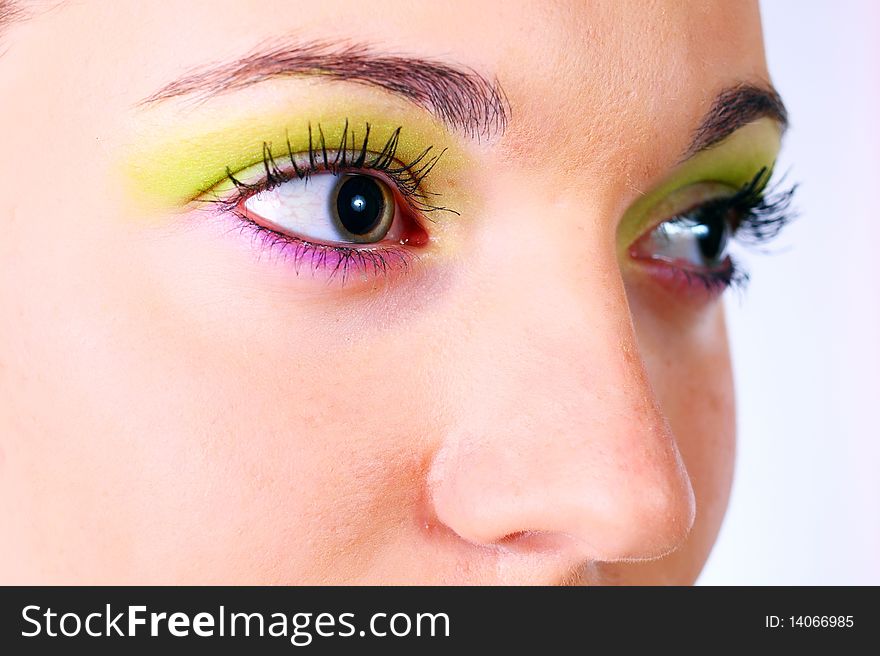 Multicolored make-up. Portrait of young beautiful woman.