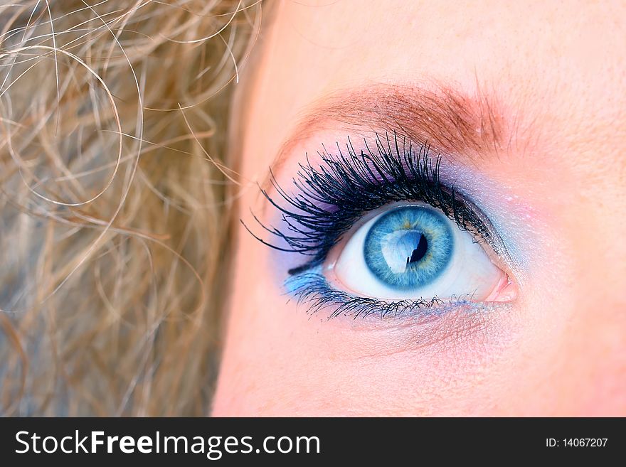 Woman eye with extremely long eyelashes.