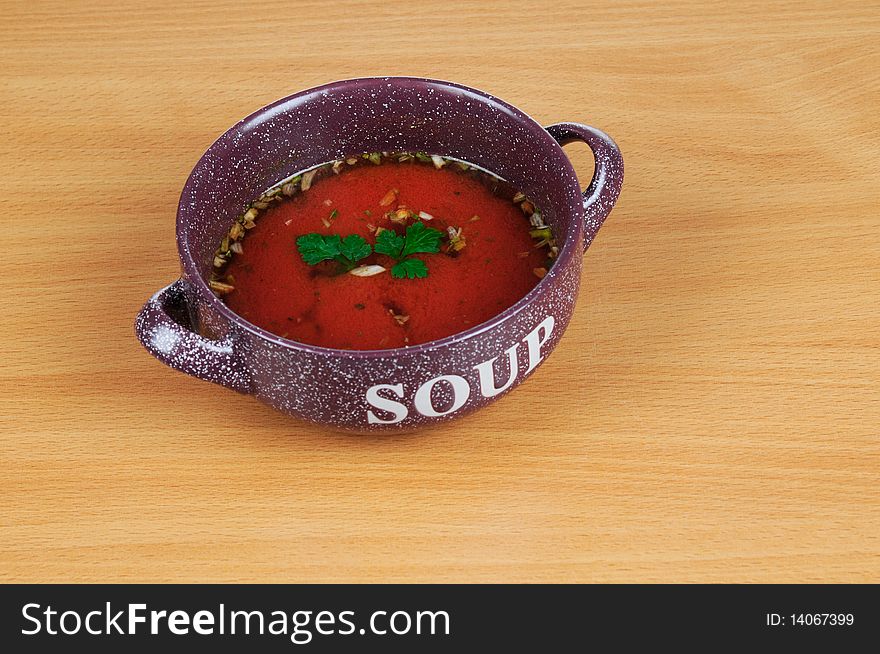 Bowl of tomatoes soup isolated on white background.