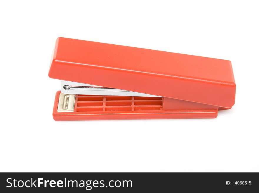 Red stapler isolated on white background. Isolated