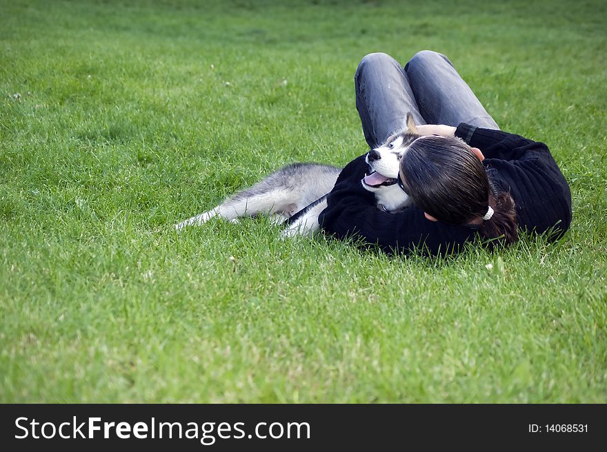 A boy play with his dog in greeen garden. A boy play with his dog in greeen garden