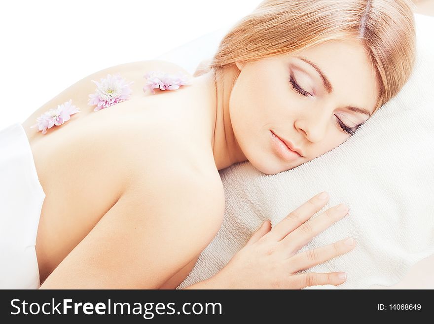 Young pretty girl lying with closed eyes