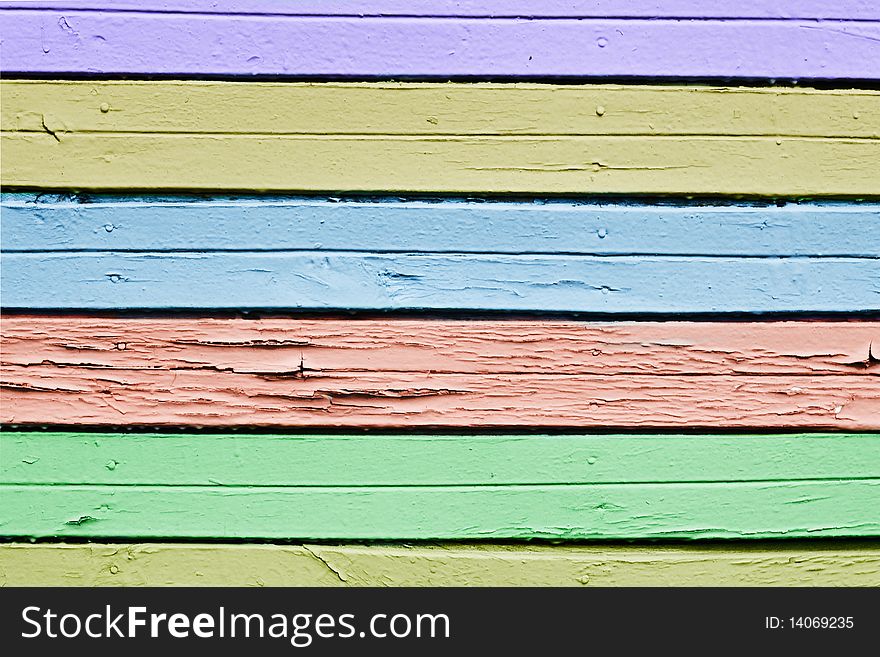 Multicolored rusty vintage wooden planks background. Multicolored rusty vintage wooden planks background