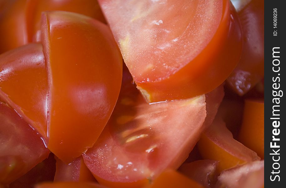 Fresh tomatoes sliced and mixed creating a nice food-themed background. Fresh tomatoes sliced and mixed creating a nice food-themed background.
