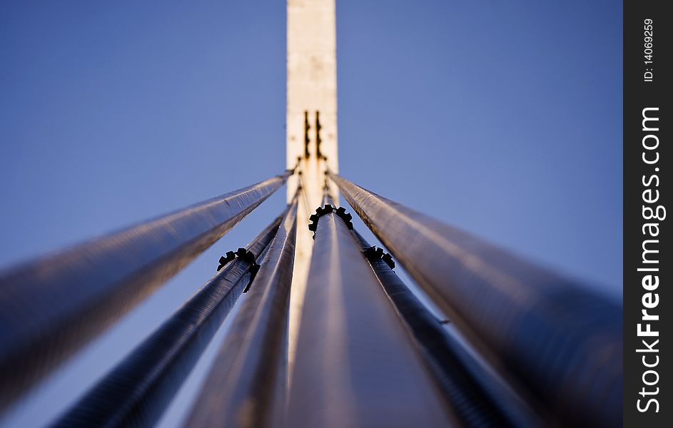 Cables of suspension bridge with support  - perspective to the sky.