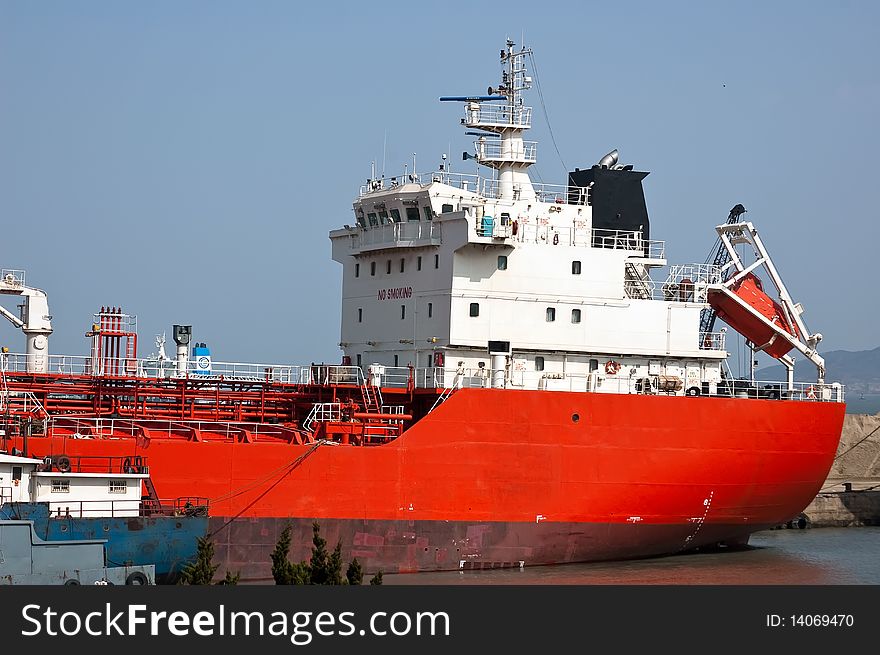 Tanker docked at    a dock at Qingdao China. Tanker docked at    a dock at Qingdao China