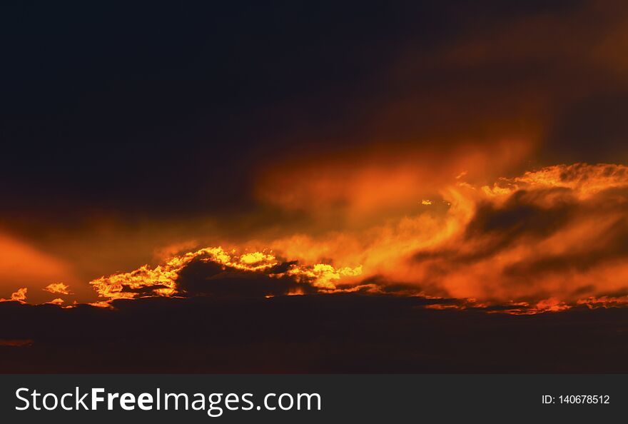 Beautiful sunset with dramatic clouds on the sky