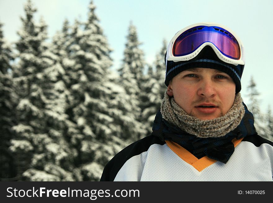 Man portrait with ski goggles outdoors