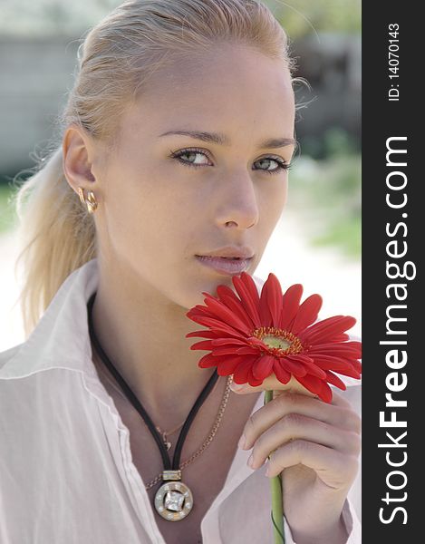 Girl In White With A Red Flower