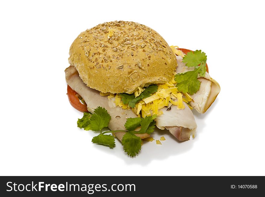 Bun sandwich with ham, cheese and tomato isolated on a white background