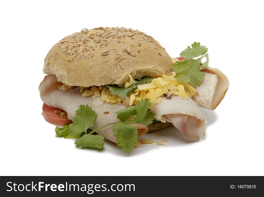 Bun sandwich with ham, cheese and tomato isolated on a white background