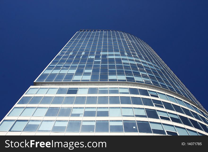 Lonely skyscraper against the blue sky