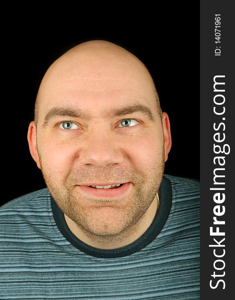 Happy man portrait on a black background