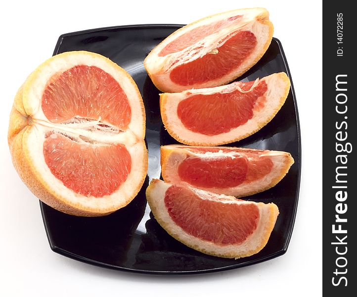 Chopped grapefruit on the plate