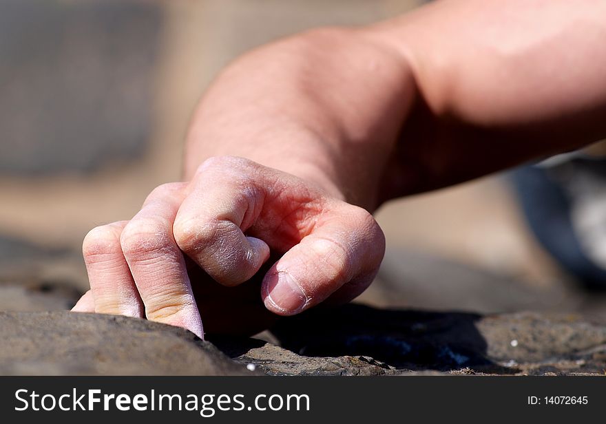 Male person climbing a wall