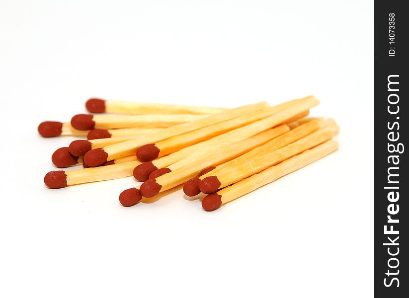 A pile of matches isolated on white background