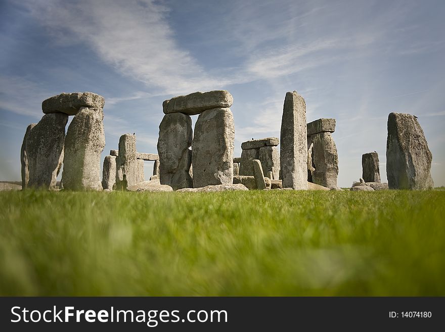 Stonehenge from blurred grass on a sunny day. Stonehenge from blurred grass on a sunny day