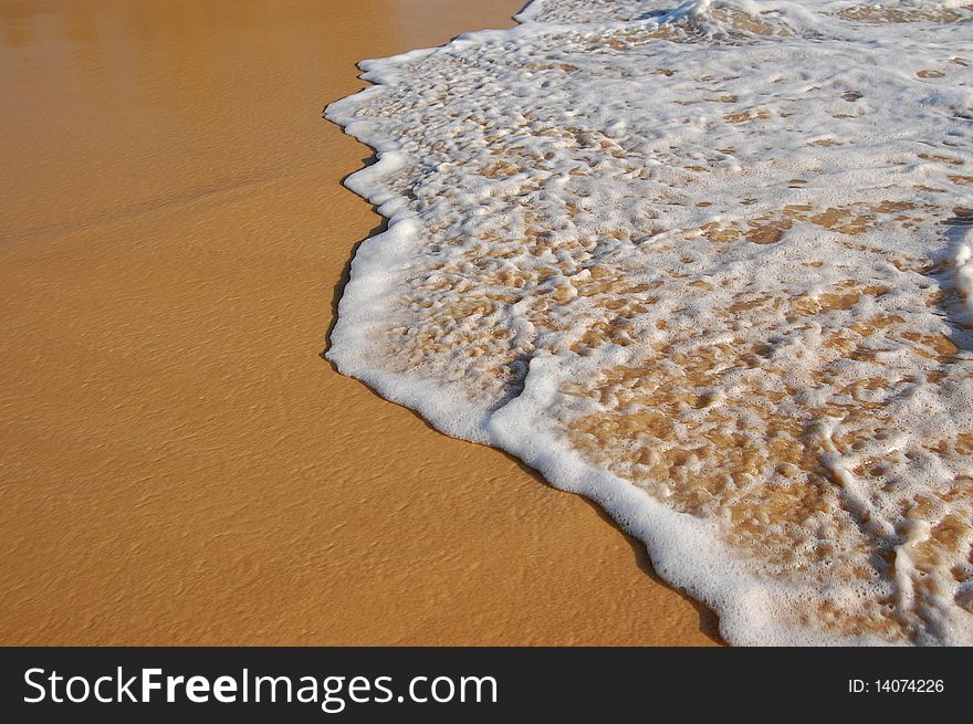 Wave on sand, tropical beach