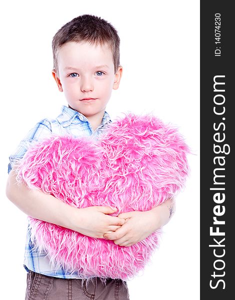 Cute baby boy holding a heart-fur and pink