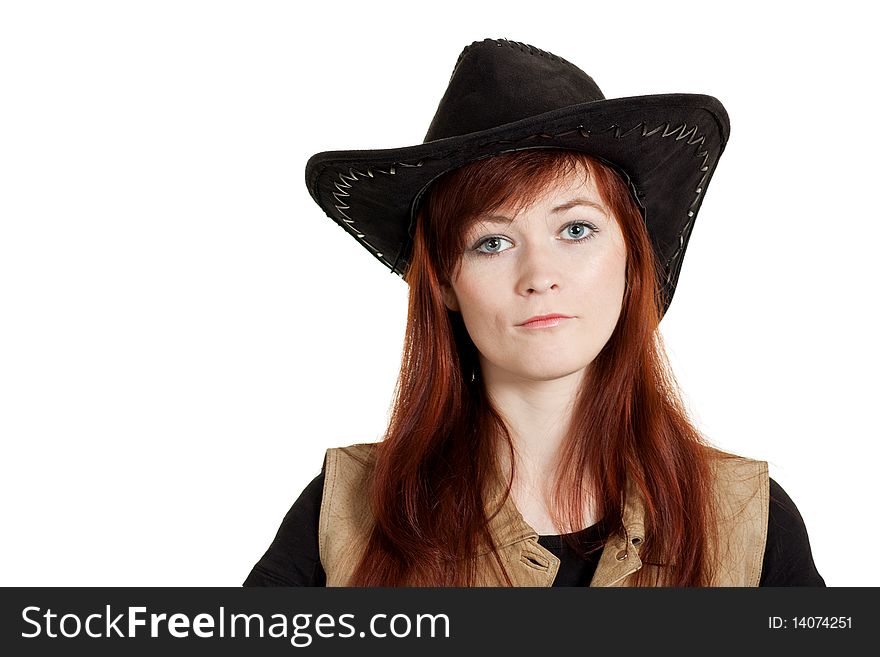 Seriously looking red-haired girl in cowboy hat. Seriously looking red-haired girl in cowboy hat