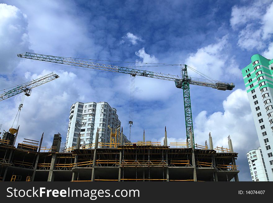 Construction of modern skyscrapers and building crane. Construction of modern skyscrapers and building crane