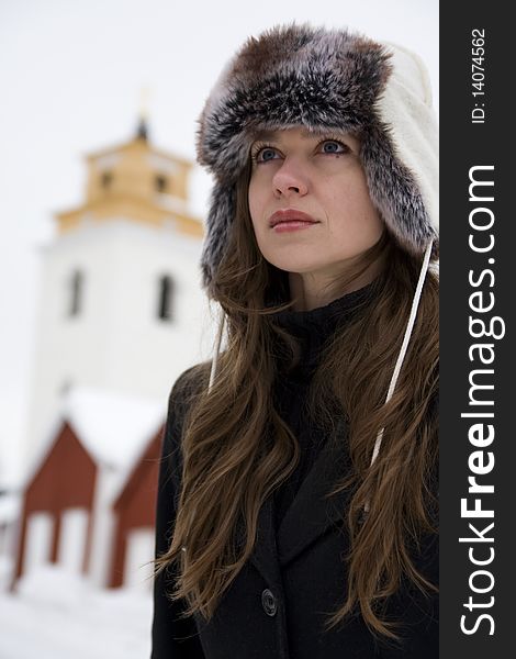 Young beautiful woman in snowy rural environment. Young beautiful woman in snowy rural environment