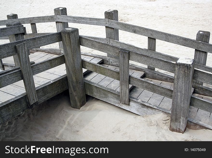Grey wooden walkway on a Belgian beach. Grey wooden walkway on a Belgian beach