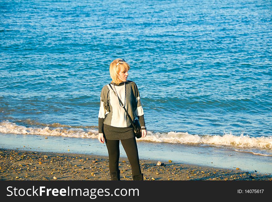 Young woman looking left on the beach