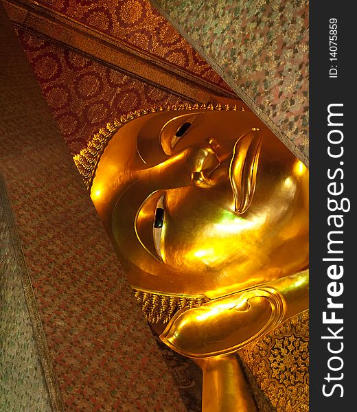 Face of the Reclining Buddha , temple Wat Pho, Bangkok, Thailand