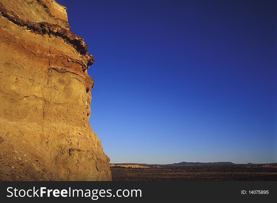 Cliff with blue sky at sunset, copy space.