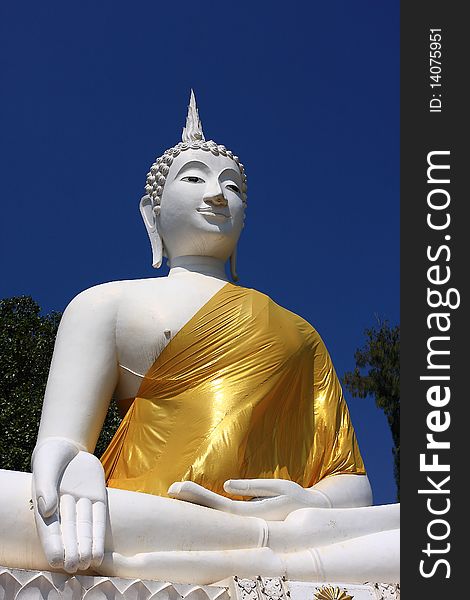 Large white Buddha cut the blue sky