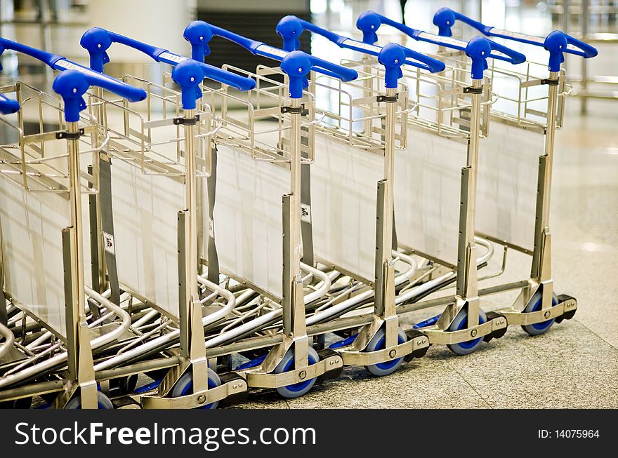 Close-up picture of Row of stack airport luggage trolley.