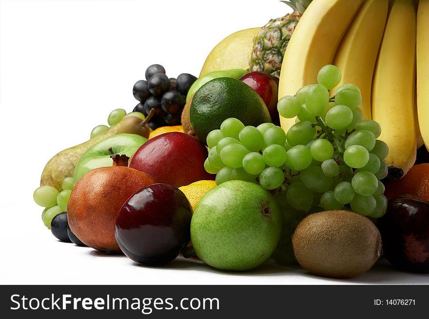 Ripe fresh fruit on white background
