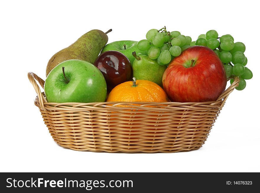 Ripe fresh fruit in basket on white background