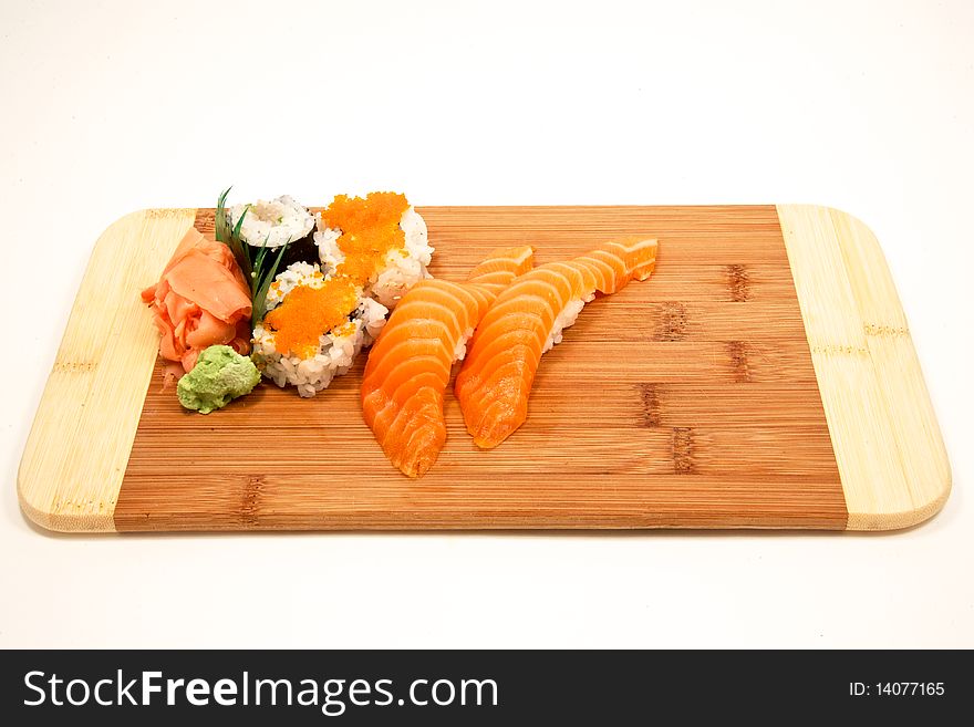 Fresh sushi on a babmoo cutting board. Fresh sushi on a babmoo cutting board