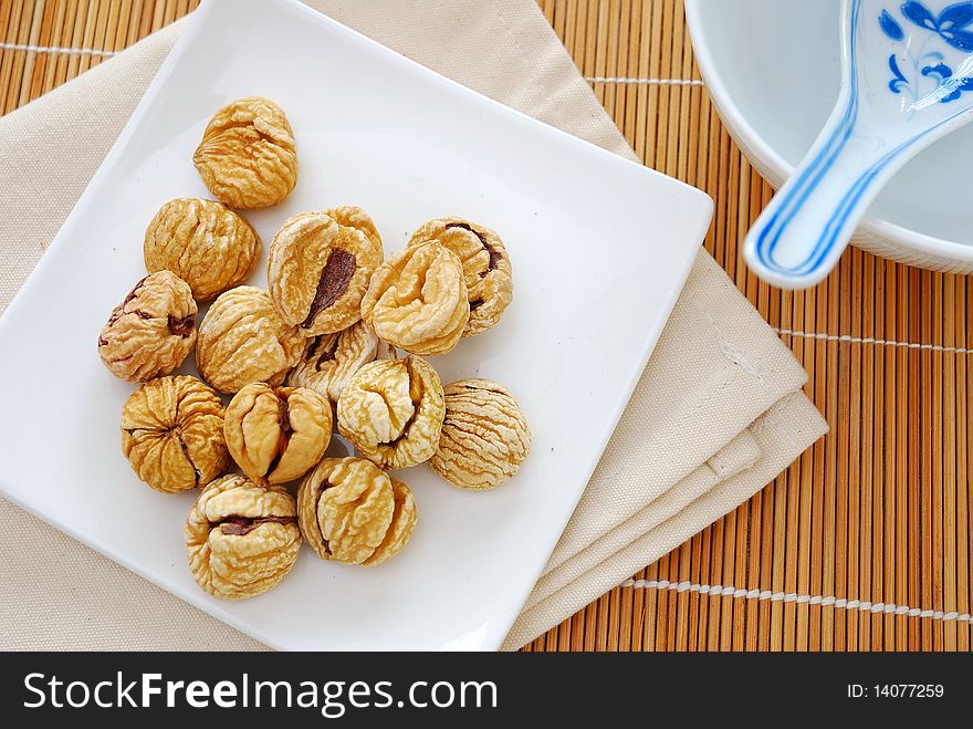 Dried chestnuts used as food ingredients in Chinese desserts and cuisine. For food and beverage, and nutritional concepts. Dried chestnuts used as food ingredients in Chinese desserts and cuisine. For food and beverage, and nutritional concepts.