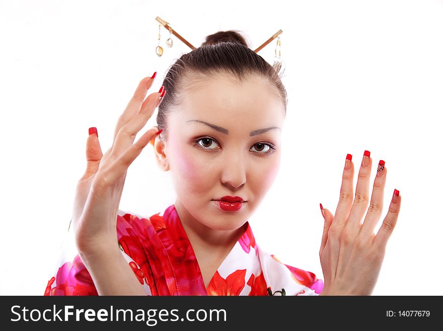 Portrait of the girl of the Asian appearance, with a make-up under the geisha, on a white background. Portrait of the girl of the Asian appearance, with a make-up under the geisha, on a white background