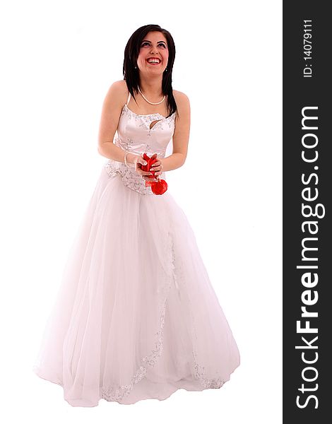 Smiling bride throws rose petals isolated over white background