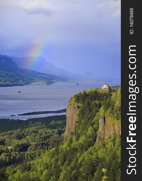 A stormy weather in the Columbia River Gorge Oregon and a rainbow formation. A stormy weather in the Columbia River Gorge Oregon and a rainbow formation.