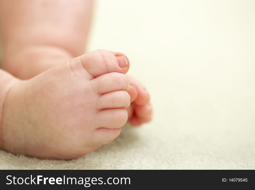 A newborn baby closeup feet. shallow DOF, focus on toes