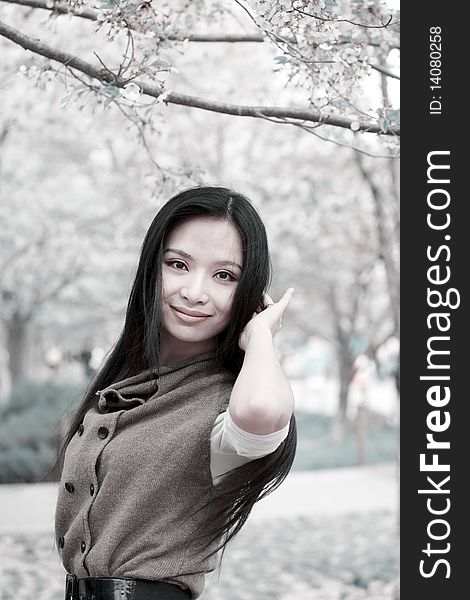 Beautiful Asian girl's portrait under cherry tree. Beautiful Asian girl's portrait under cherry tree.