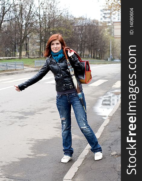 Girl stopping a car in city