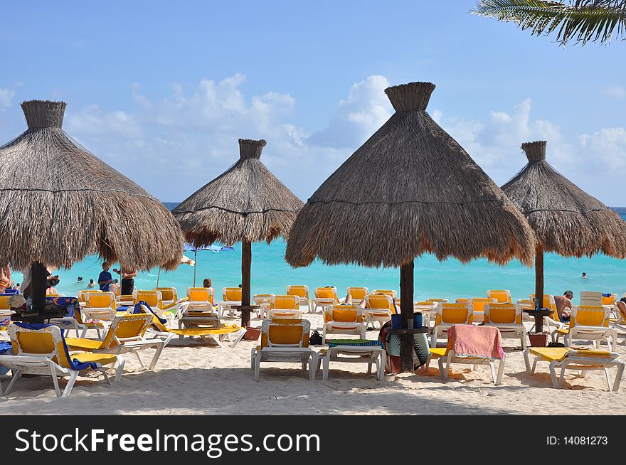 Sea, sand, umbrellas from the sun on a resort beach of peninsula Yucatan. Sea, sand, umbrellas from the sun on a resort beach of peninsula Yucatan.