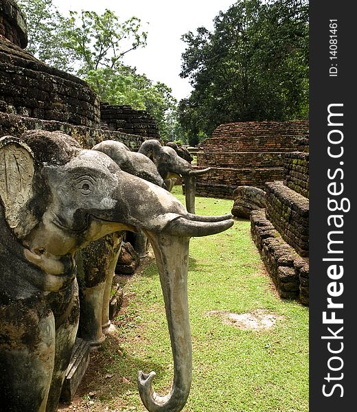 Stone elephant statue in the ruins of a Buddhist temple