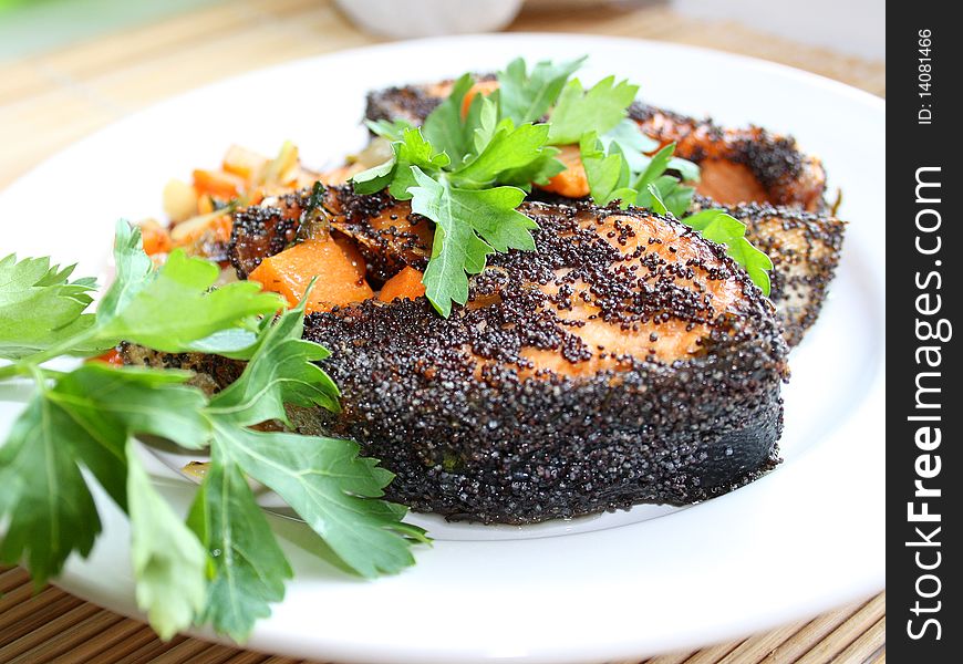 Dinner of grilled salmon, breaded poppy. Dinner of grilled salmon, breaded poppy