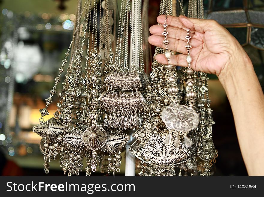 Woman necklace accessories at traditional antique market