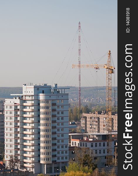 New building and tower crane - typical urban landscape