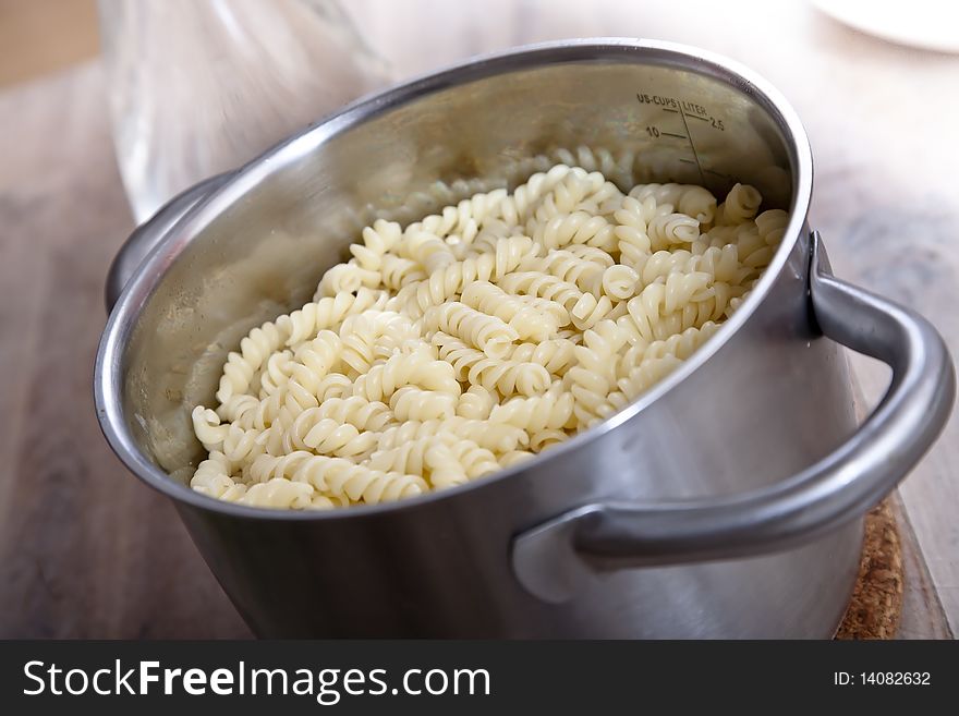 Fussili pasta, cooked in a sauce pan