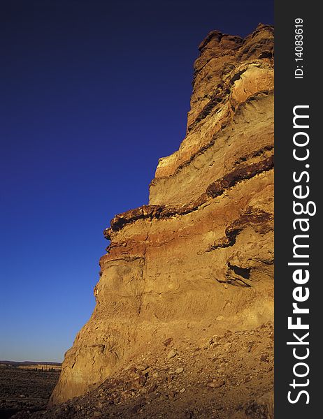 Cliff with blue sky at sunset, copy space.